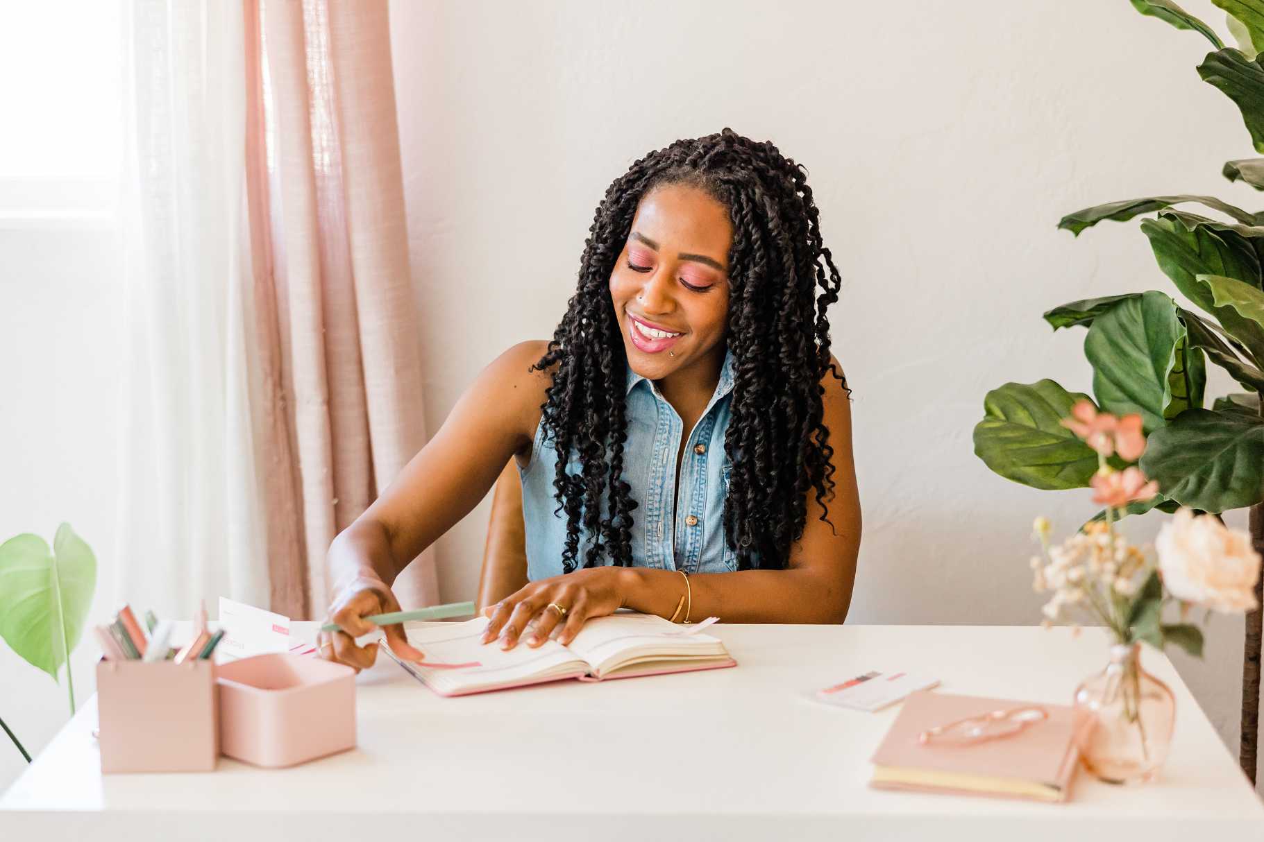 brown skin girl writing in her planner